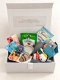 Let’s Get a Cat new kitten gift hamper in a white keepsake box with plush cat bed, ceramic bowl, grooming brush, Greenies and Temptations treats, feather ball and sushi cat toys