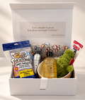 Let’s Get a Dog new puppy gift hamper in a white keepsake box with Bondi Wash dog wash and kennel spray, paw-print blanket, ceramic bowl, KONG crocodile toy and chicken treats