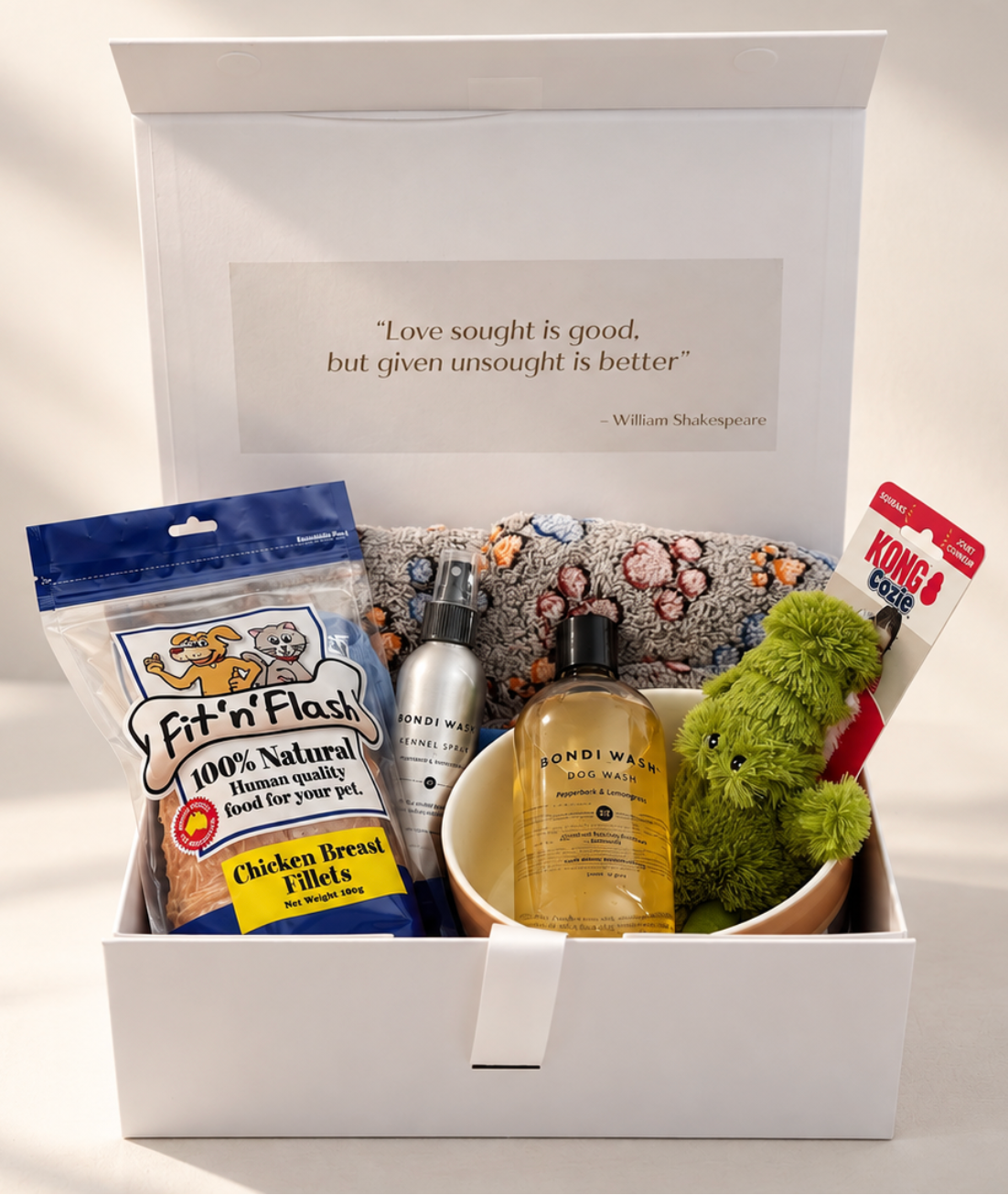 Let’s Get a Dog new puppy gift hamper in a white keepsake box with Bondi Wash dog wash and kennel spray, paw-print blanket, ceramic bowl, KONG crocodile toy and chicken treats