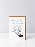 Loving You greeting card with a hand-drawn gloved hand serving a heart on a silver platter beneath stars, with a kraft envelope