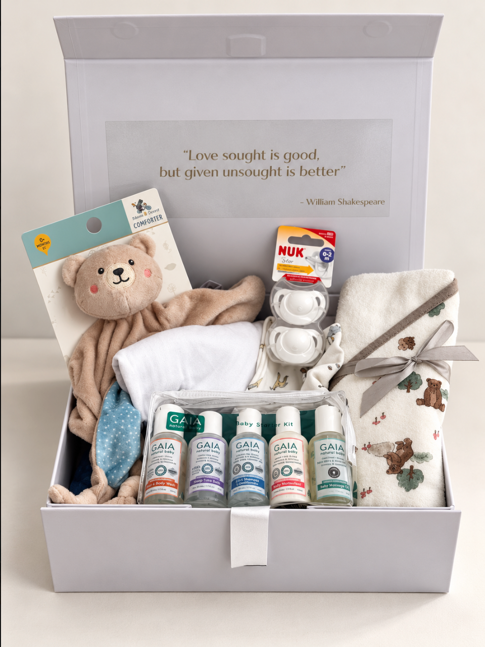 Welcome Baby Boy gift hamper in a white keepsake box with teddy bear hooded towel, teddy comforter, muslin wrap, NUK soothers and GAIA Natural Baby starter kit