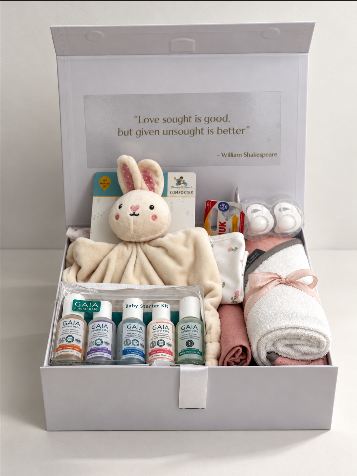 Welcome Baby Girl gift hamper in a white keepsake box with hooded baby towel, comforter, muslin wrap, NUK soothers and GAIA Natural Baby starter kit