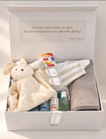 Welcome Baby gender neutral gift hamper in a white keepsake box with hooded baby towel, comforter, muslin wrap, NUK soothers and GAIA Natural Baby starter kit