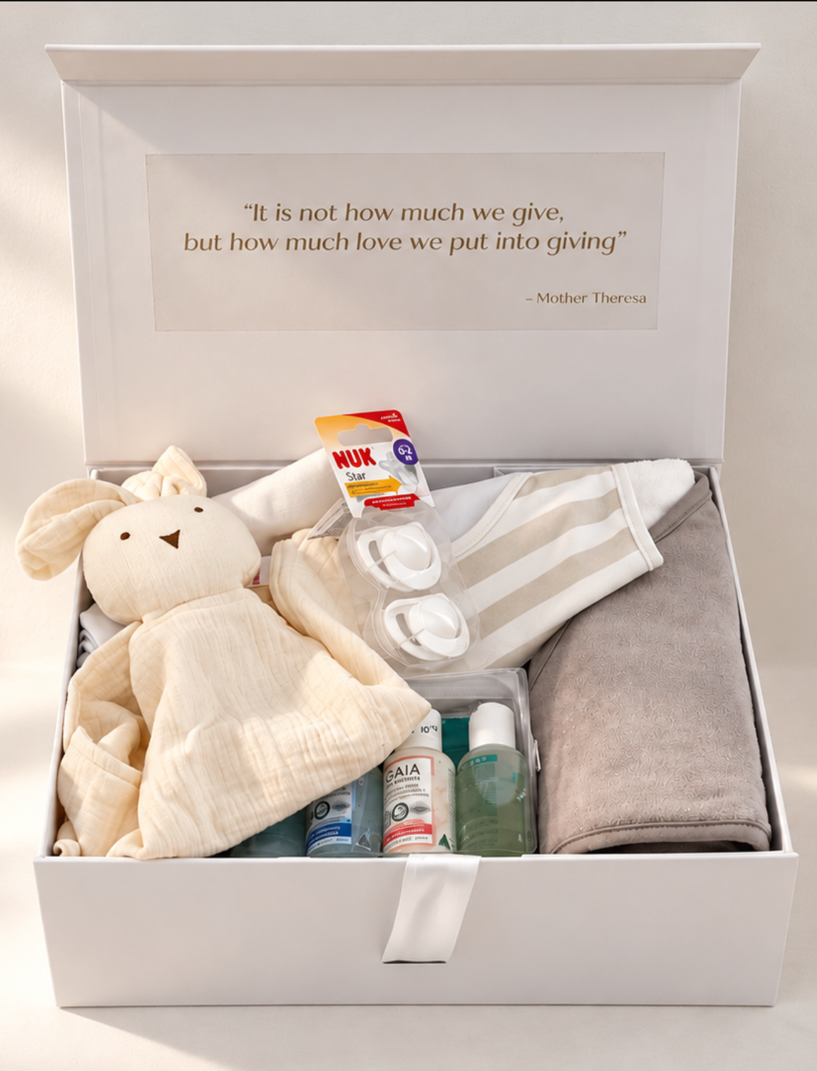 Welcome Baby gender neutral gift hamper in a white keepsake box with hooded baby towel, comforter, muslin wrap, NUK soothers and GAIA Natural Baby starter kit